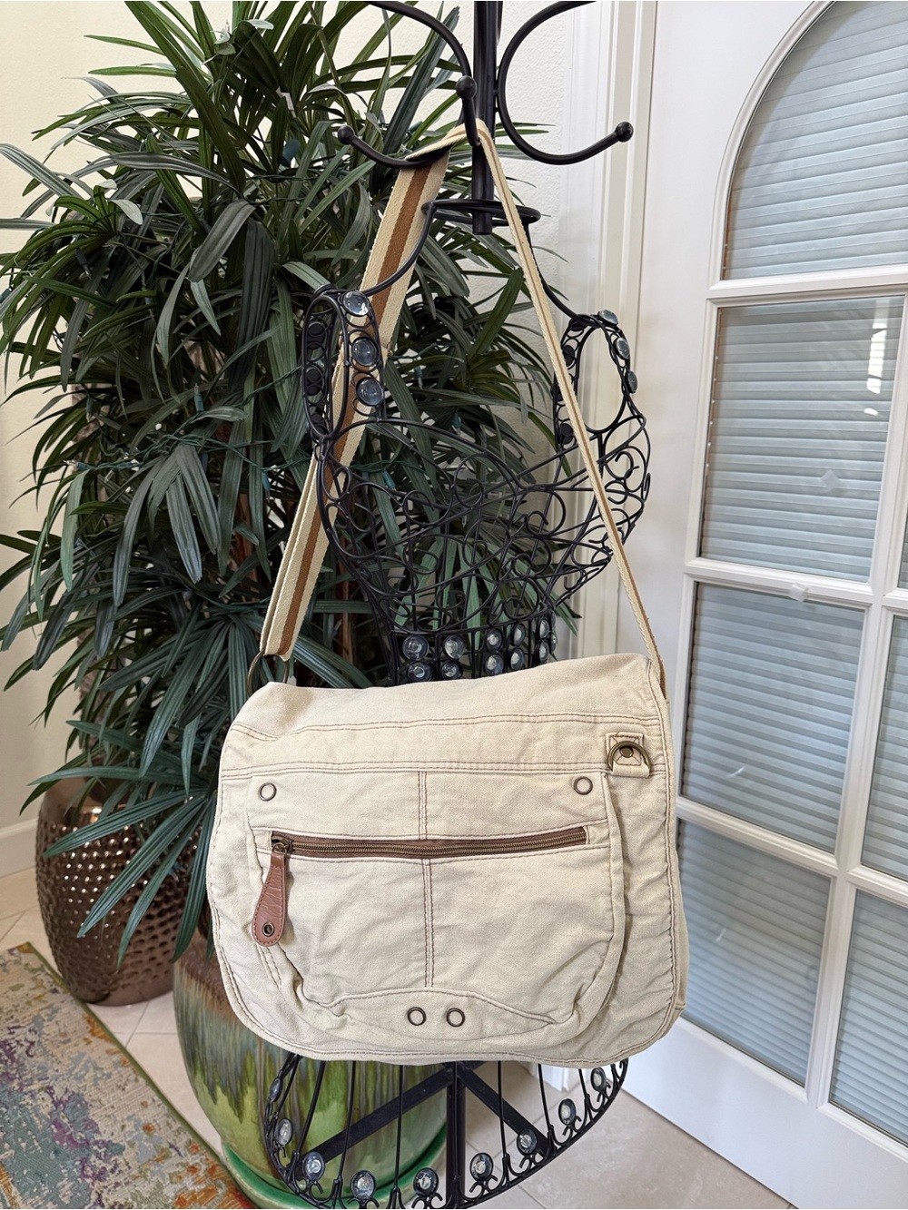 Cream Canvas Crossbody Bag with Striped Adjustable Strap.